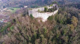Aerial shot a medieval ruins on a hill in Tuscany