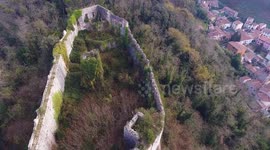 Aerial shot, medieval ruins on the hill, overcast weather, Europe, filmed with drone