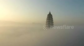 Aerial footage of heavy fog creating sea cloud like fairytale