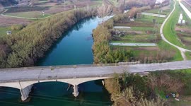 Aerial shot, beautiful little river in the middle of the fall nature in Italy, Tuscany, filmed with drone