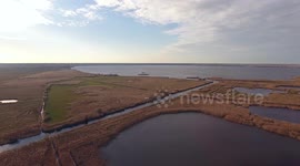 Aerial shot, fall landscape with the big lake, filmed with drone