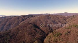 Aerial shot, gorgeous hills in the morning fog