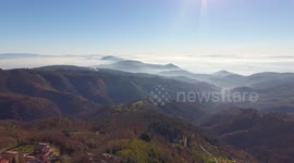 Aerial shot , gorgeous hills in the morning fog