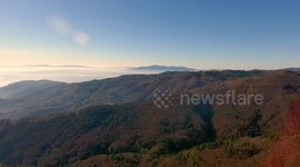 Aerial shot, gorgeous hills in the morning fog