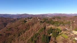 Aerial shot, gorgeous hills in the morning fog
