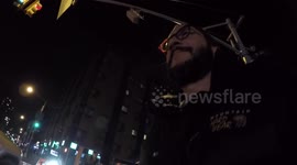 Trying to hail a taxi in New York City