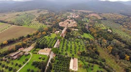 Aerial shot, a small ancient town situated in the middle of rural landscape