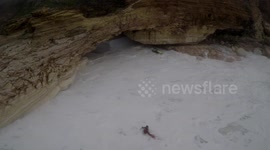 Jet ski and Surfer Crashing into rocks and ending up inside a Cave, Nazaré - Portugal