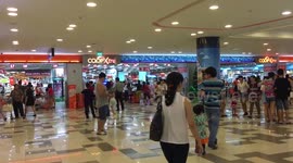 People are busy in a shopping mall in Vietnam on holiday