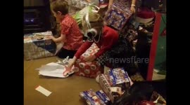 FUNNY Girl hits herself in the face with excitement when opening Christmas present