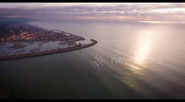 Aerial shot, small port in the winter sunset, in Pisa, Tuscany, Italy, filmed with drone