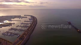 Aerial shot, small port in the winter sunset, in Pisa, Tuscany, Italy, filmed with drone