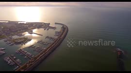 Aerial shot, small port in the winter sunset, in Pisa, Tuscany, Italy, filmed with drone