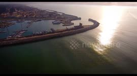 Aerial shot, small port in the winter sunset, in Pisa, Tuscany, Italy, filmed with drone