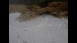 Surfer caught in rough sea while trying to collect jet ski in Nazare