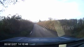 Mad uk driver racing down country lane with bonnet up! Idiot!