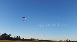 London Paraglider pilot enjoys the winter sunshine  on Dartmoor to day at the disused airfield Yelverton   near Plymouth Devon I was a bit concerned due to there was a lot of toy Quadcopters and drones in the area