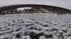 YouTuber enjoys inflatable seat on frozen lake