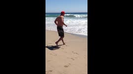 Sharing Laughter On A Sunny Day At The Beach