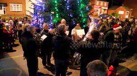 Yorkshire brass band joins locals for carol singing