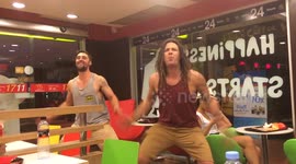 Two New Zealanders perform an impromptu Haka in a Bangkok McDonald's