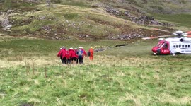 WMRT carrying casualty to the Heli