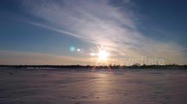 Sunset Time Lapse Over Frozen Lake