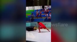 The terrifying moment a crocodile bites a trainer's hand