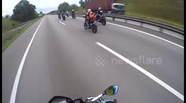 Superman rider flies on the highway