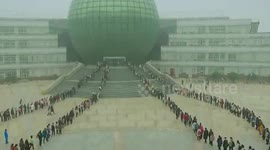 Thousands of students line up outside university library to study