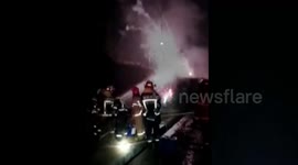 Driver rescued from overturned truck laden with exploding fireworks