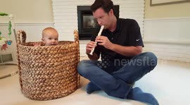 Father 'snake charms' his daughter out of a basket