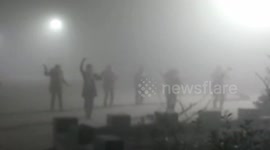 Women dance in square in China despite heavy smog