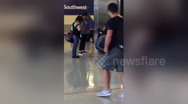Newsflare Edit - Golden Retriever Puppy at Southwest Airlines Gate