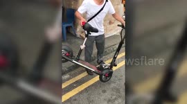 Man smashes his own scooter to stop police confiscating it