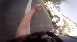 Cyclist rear ends car who stopped unexpectedly *Raw Footage*
