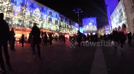 Christmas projection on the major square in Como, palace of Broletto and tower. Como Lake