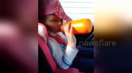 Newsflare Edit - Funny cute toddler falls asleep in car while drinking