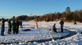 Ice Merry-Go-Round made out of spinning ice disc on frozen lake