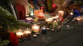 David Bowie fans pay tribute to him by the memorial of him in Brixton