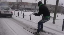 Man skis though city streets in Thessaloniki, Greece