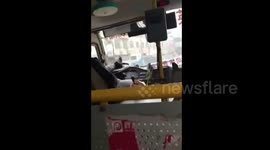 Bus driver detained for playing cellphone while driving with his foot in China