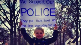 Preschooler and Police Department Best Friends