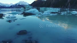 Stunning aerial view of a glacier in New Zealand lake