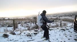 Man traverses road on skis in Northern Ireland following heavy snowfall