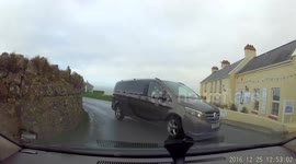 Near miss with minibus driving on wrong side of the road. Driver waves to say sorry.