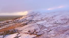 Drone View Of Dramatic Snow Covered In Mountain In N. Ireland!