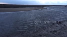 The tide arrives in Blakeney night if the surge