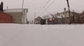 Snowing on a small road