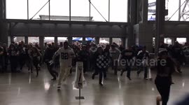 American football fans rush through the doors as AT&T Stadium opens